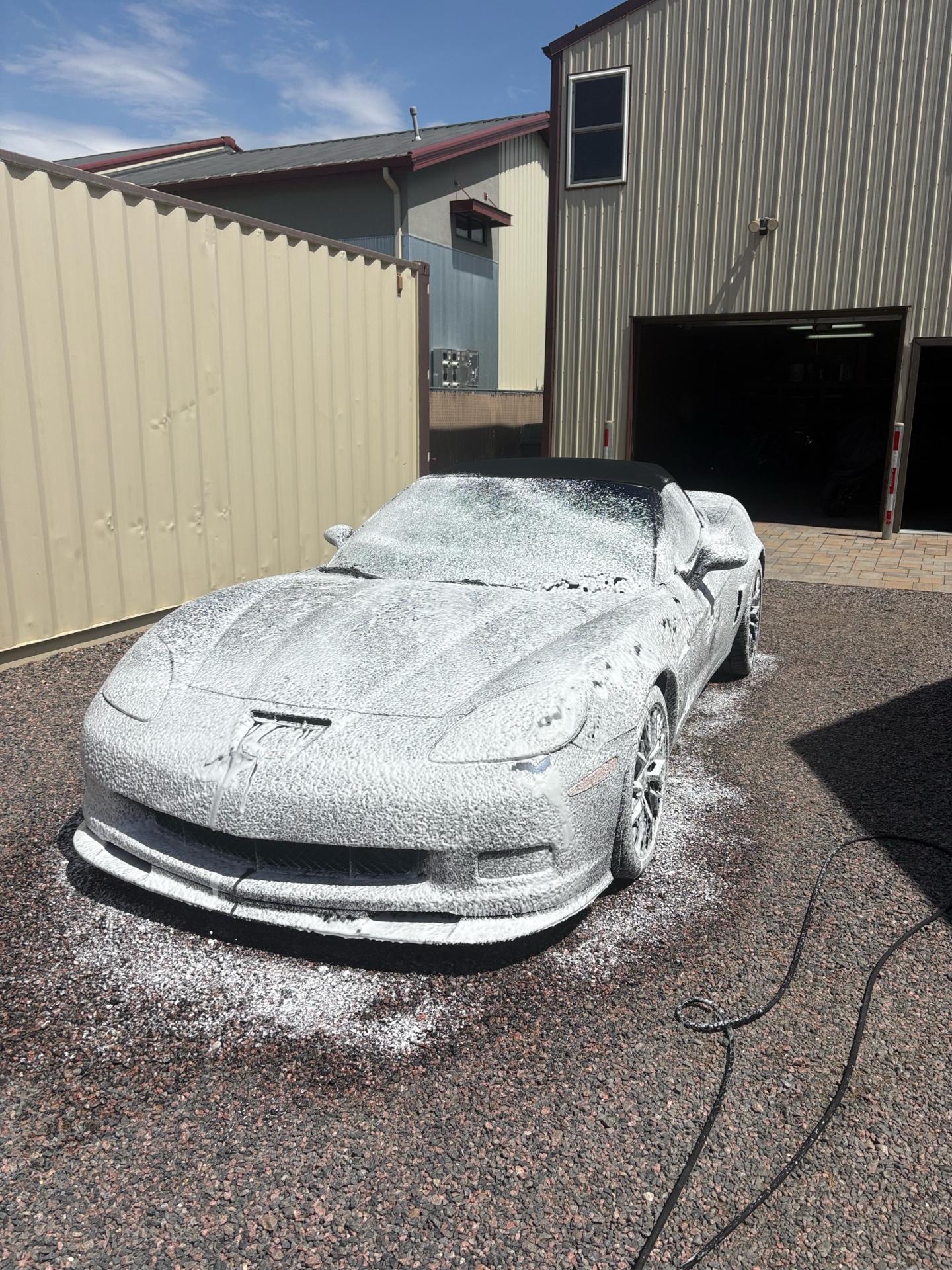 Black Corvette during foam wash